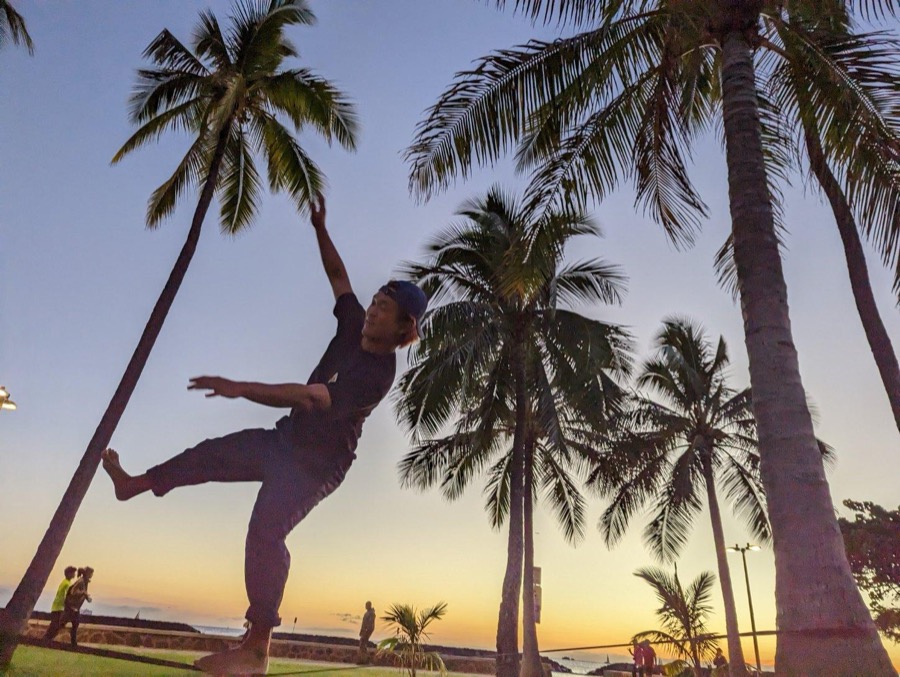 Goofing around under palm trees at sunset